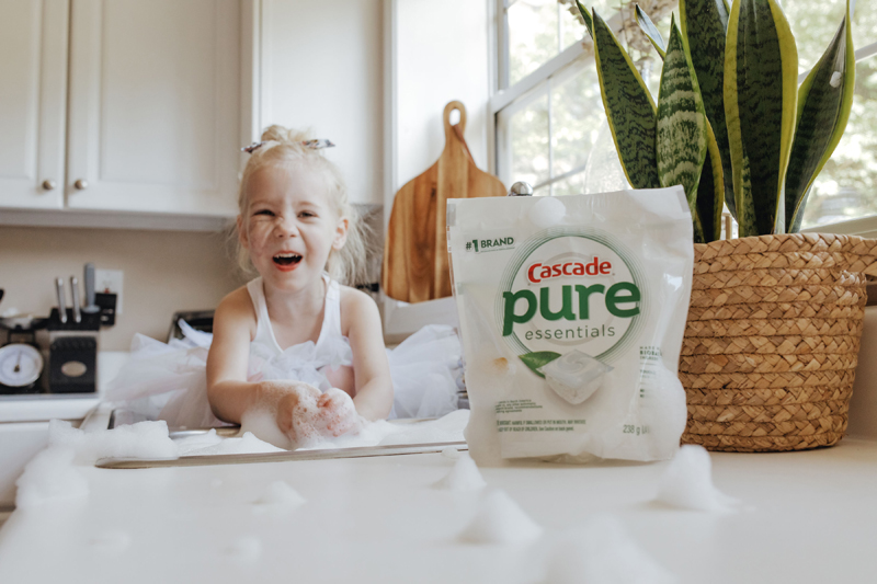 Atlanta Blogger-Influencer Photographer, toddler plays with bubbles in the sink, Cascade pure sits on the counter
