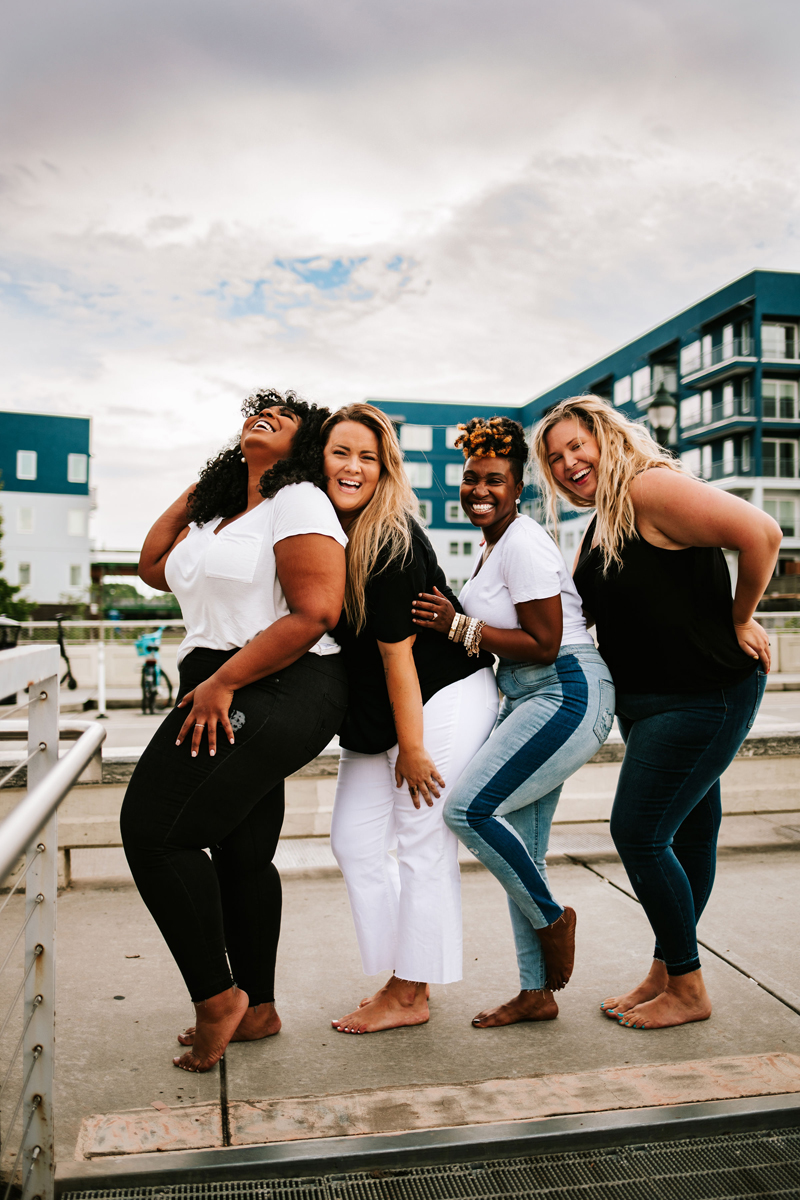 Atlanta Blogger-Influencer Photographer, four women playfully pose and laugh for a photo