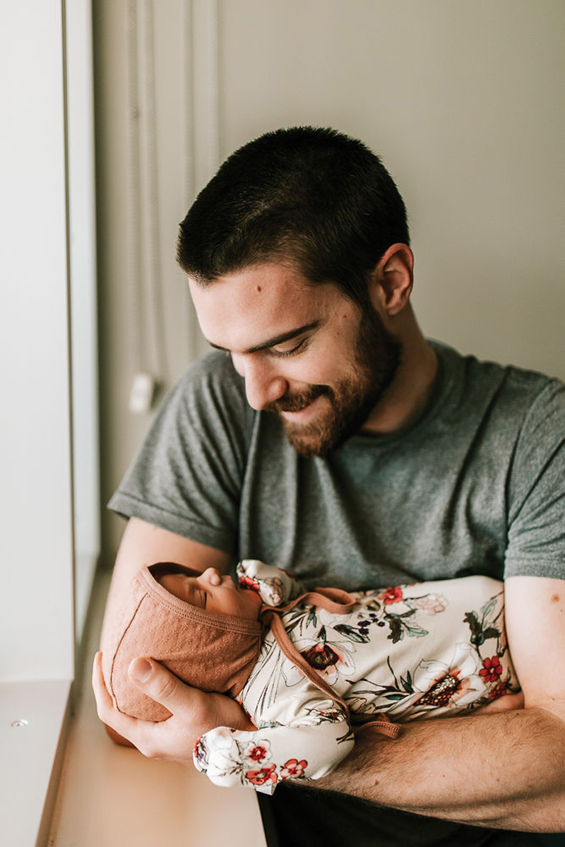 Atlanta Newborn Photographer, new dad gazes into baby's eyes