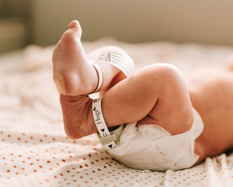 Atlanta Newborn Photographer, little newborn baby feet with hospital anklets