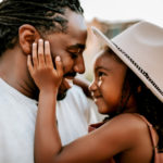 Atlanta Family Photographer, little girl in hat touching her dad's cheek