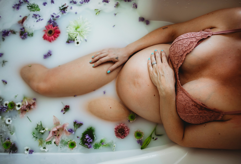Atlanta Maternity Photographer, expecting Pregnant mother takes a relaxing bath full with flowers