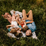 Photography Workshops, Family of four laying in the grass together