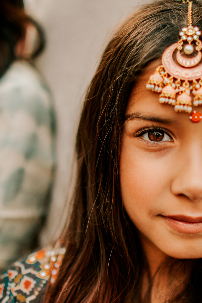 Atlanta Family Photographer, young woman wears decorative Native American cultural attire